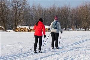 Two women cross country skiing